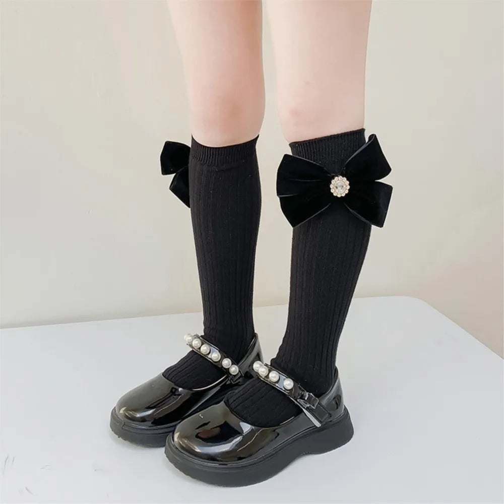 Chaussette longue noir nœud papillon perle