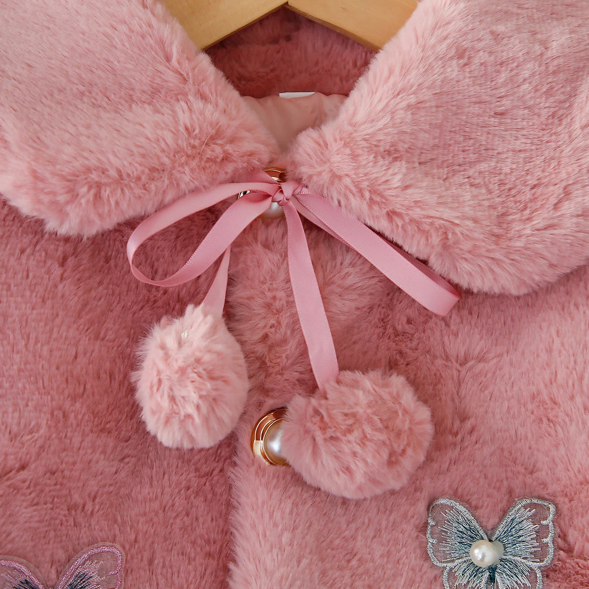 Gillet fausse fourrure papillon