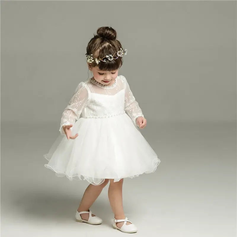 Robe baptême bébé manches évasés en tulle