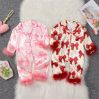 Pyjama barboteuse bébé fille rose avec manches et chevilles en fausse fourrure – 9 mois