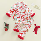 pyjama de noël enfant blanc à motifs biscuits pain d’épices et nœuds rouges sur fond clair