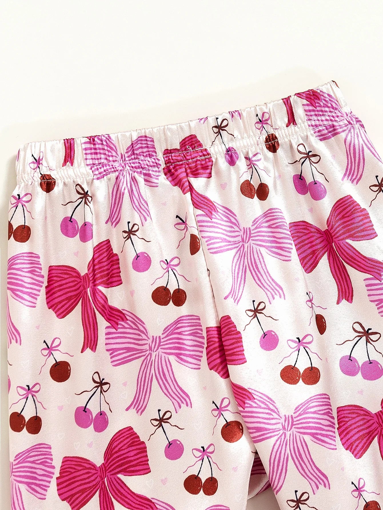 Détail taille pantalon pyjama fille rose nœuds & cerises – coupe confortable