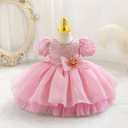 Robe bébé fille rose à manches bouffantes et jupe en tulle superposée, idéale pour cérémonie ou anniversaire