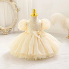 Robe bébé fille ivoire à manches bouffantes et grand nœud à la taille, élégante et raffinée