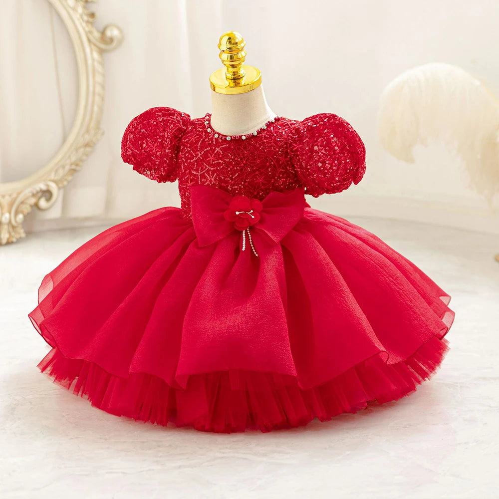 Robe bébé fille rouge à manches bouffantes et jupe en tulle superposée, idéale pour cérémonie ou Noël