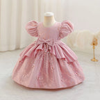 Robe rose poudré pour fille, brodée de papillons et ornée d’un grand nœud