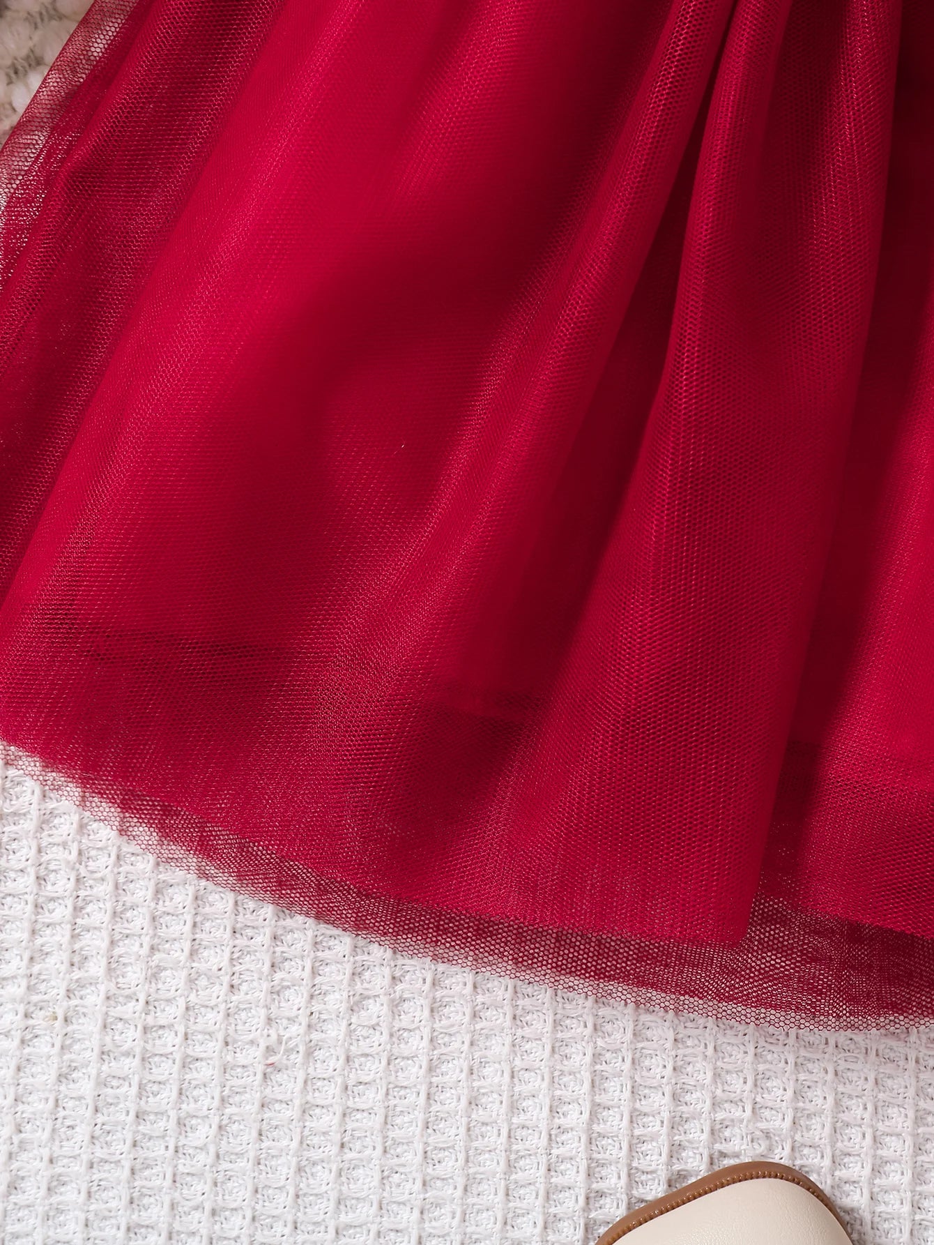 Détail du tulle léger et fluide de la robe Kristina