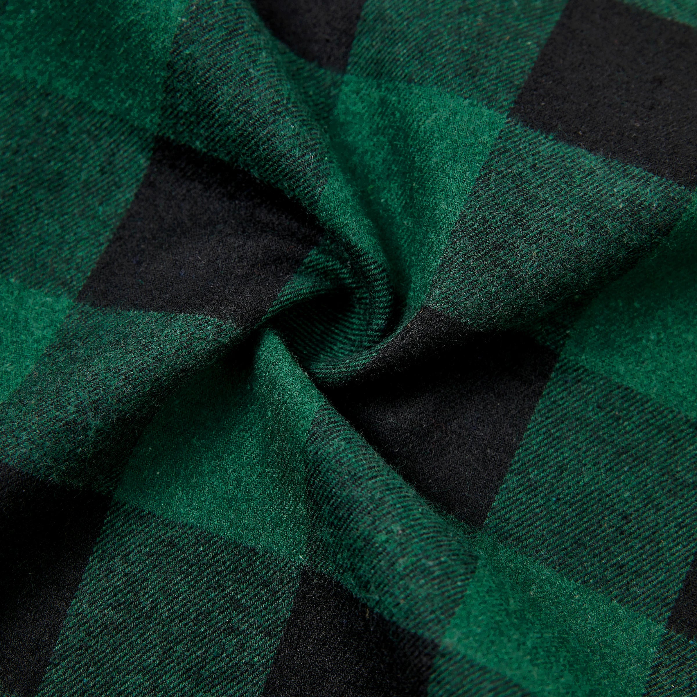 Texture du tissu à carreaux verts et noirs en coton doux