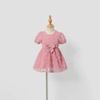 Robe bébé fille rose fluide à manches courtes et grand nœud sur le devant
