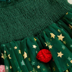 Détail du haut smocké de la robe sapin de Noël pour enfant