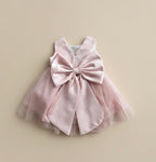 Robe baptême bébé fille rose tulle encolure perlée nœud satin 2 ans