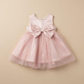 Robe cérémonie bébé fille rose poudré grand nœud satin 2 ans vue de face