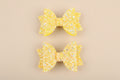 Lot de 2 pinces cheveux nœud papillon enfant doré