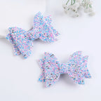 Lot de 2 pinces cheveux nœud papillon enfant bleu et rose