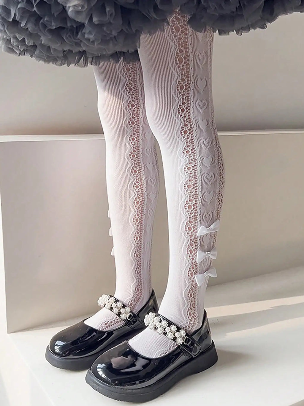 Collant per bambini con 3 piccoli fiocchi