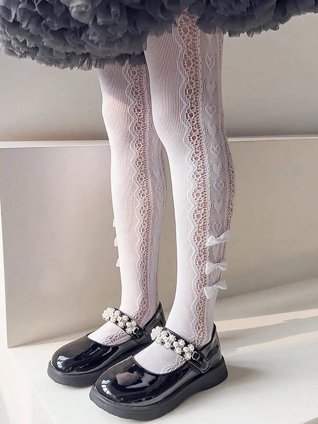 Collant per bambini con 3 piccoli fiocchi