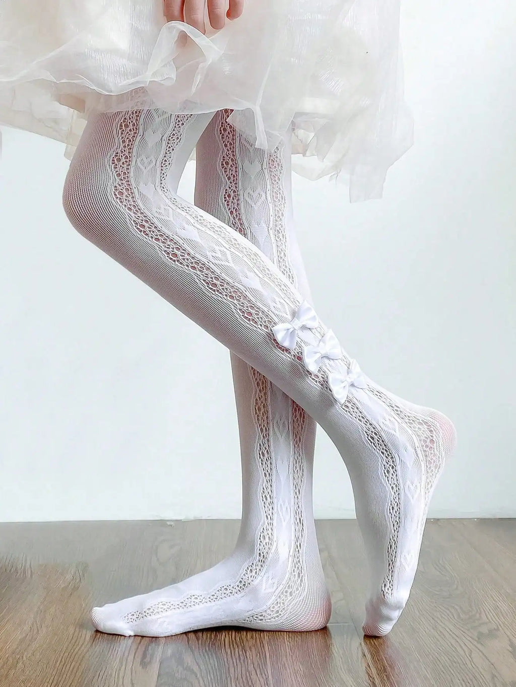 Collant per bambini con 3 piccoli fiocchi