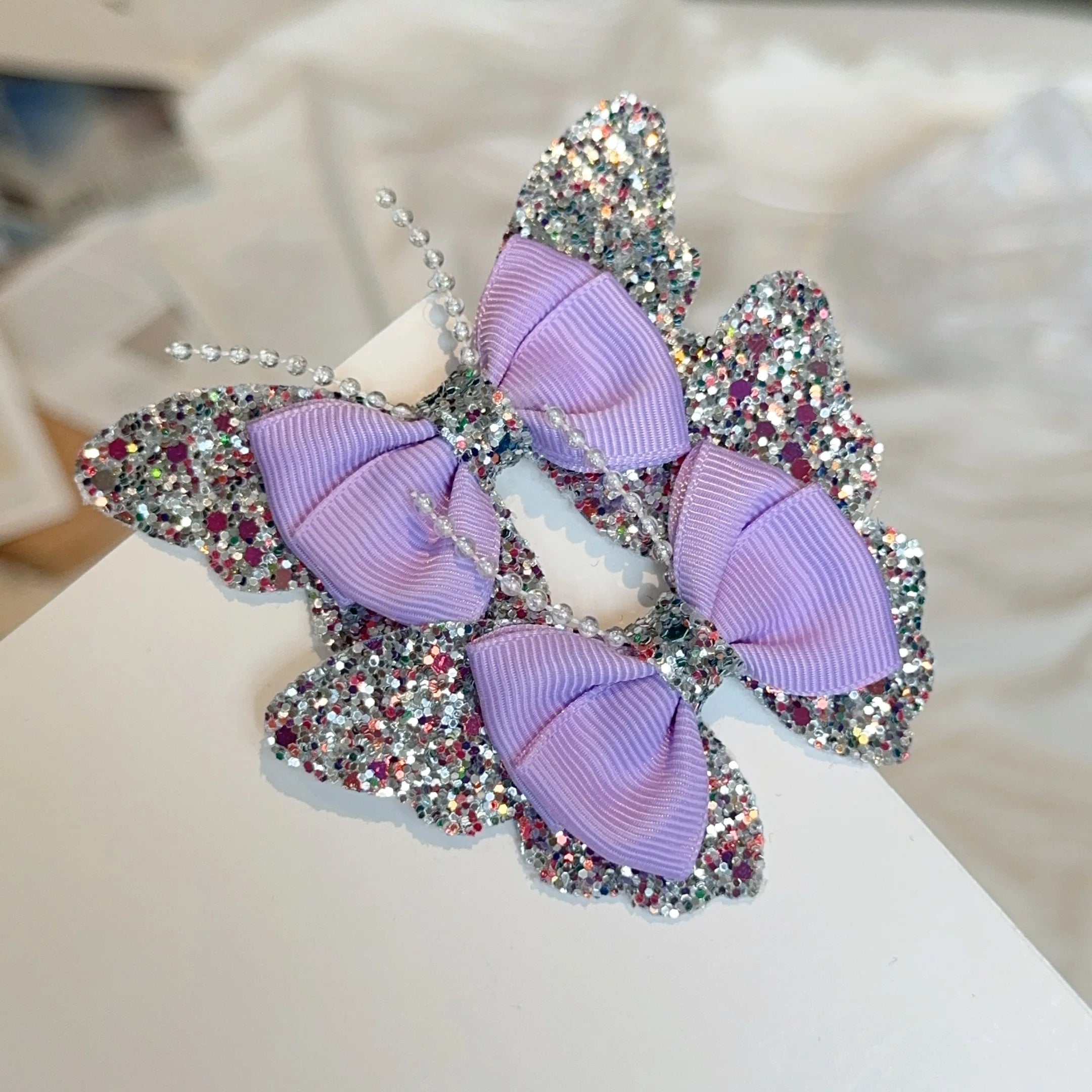 Set di 2 accessori a forma di farfalla