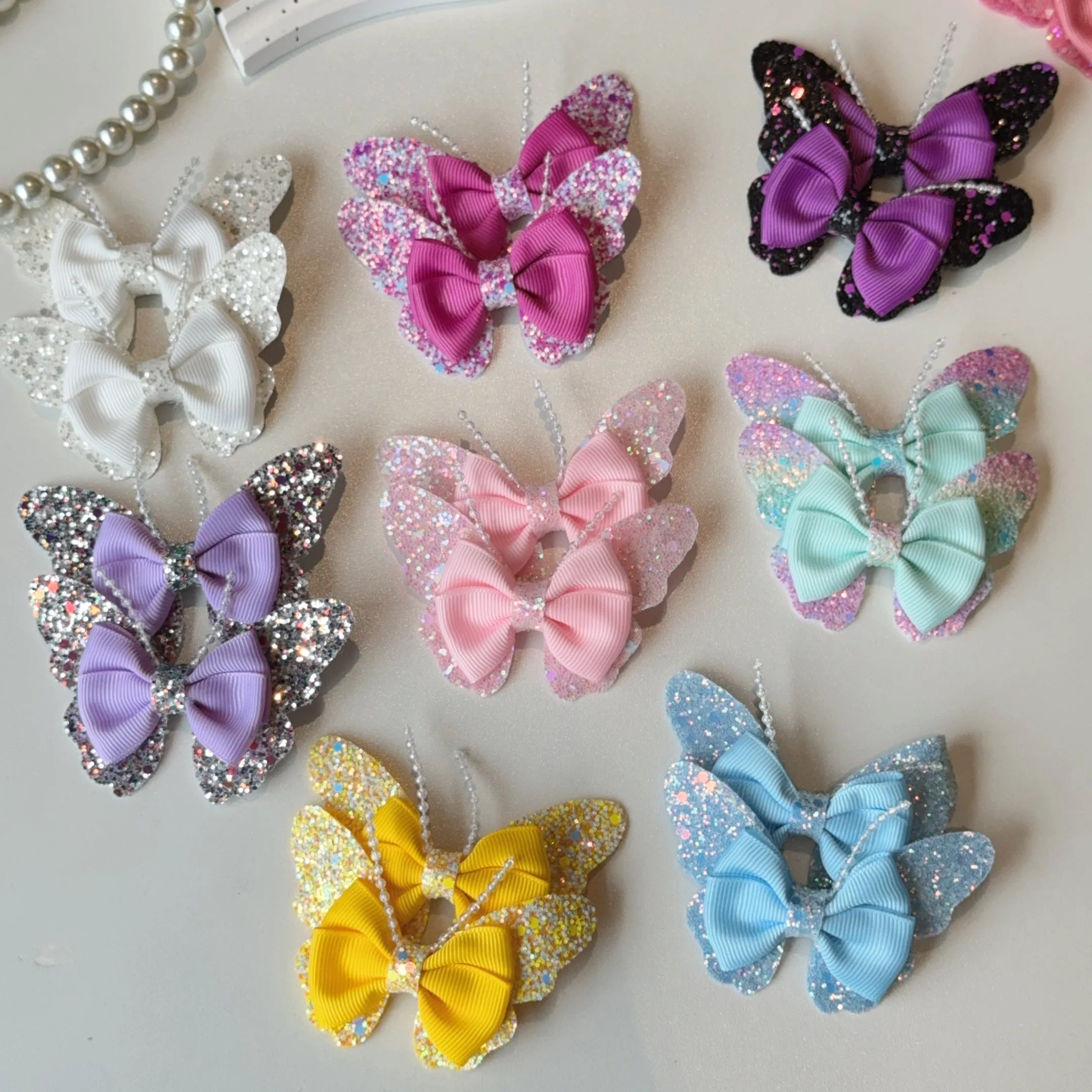 Set di 2 accessori a forma di farfalla