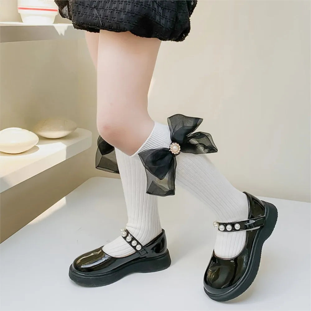 Chaussette longue noir/blanc nœud papillon