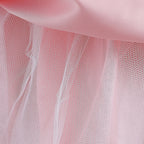 Elegante vestido de gala para niñas con un lazo en los hombros.