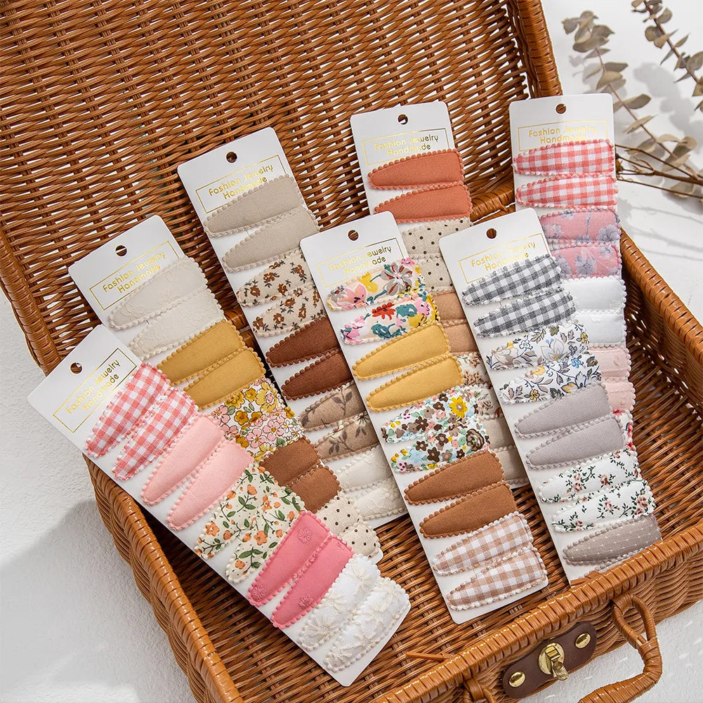 Set di 10 graziose mollette per capelli con motivi