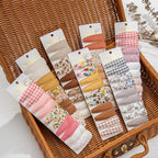 Set di 10 graziose mollette per capelli con motivi