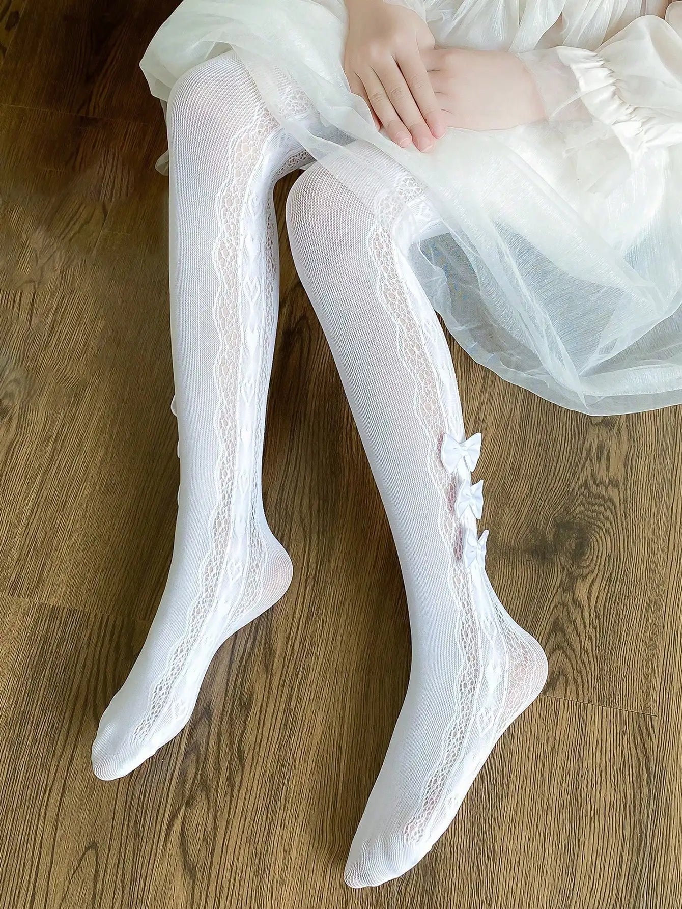 Collant per bambini con 3 piccoli fiocchi