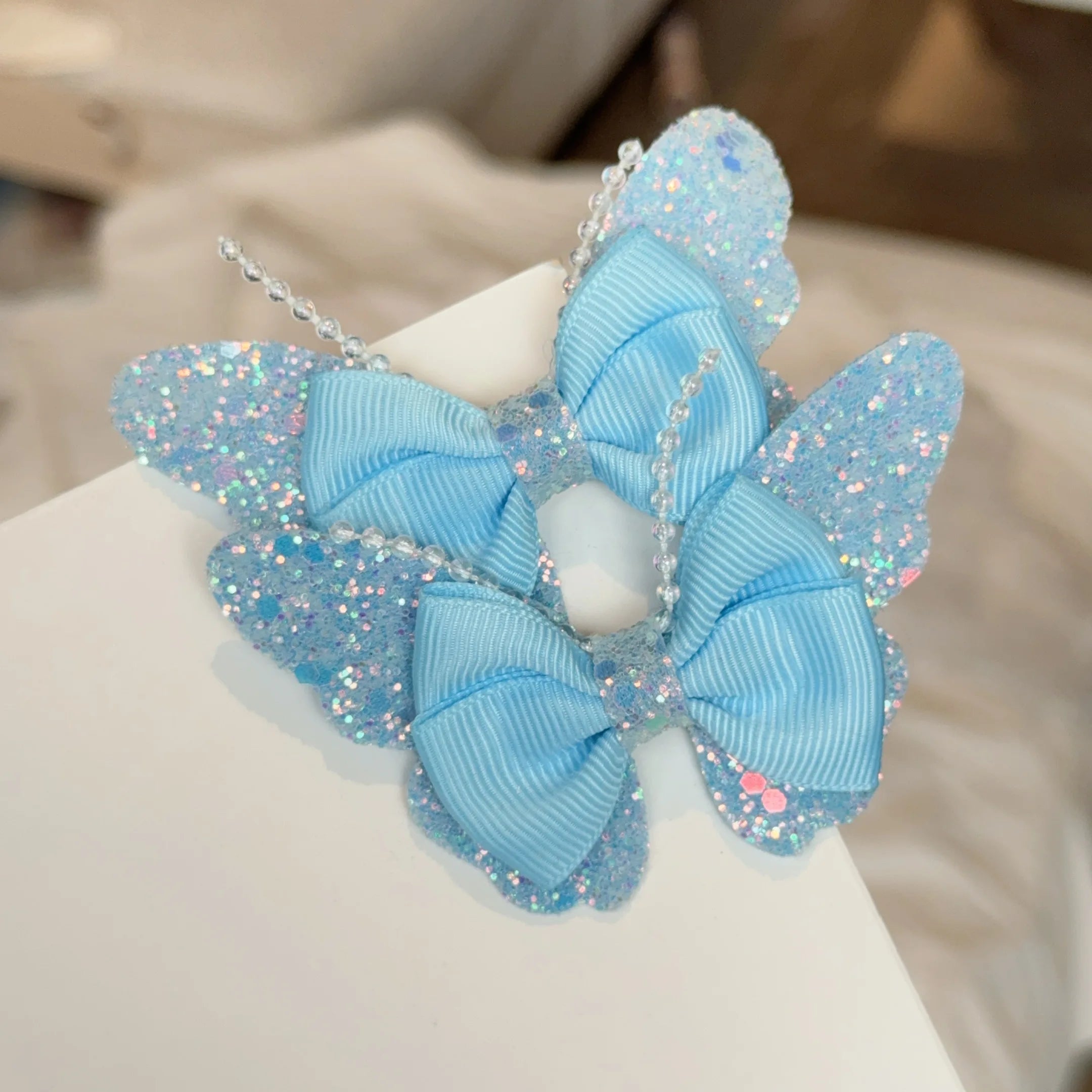 Set di 2 accessori a forma di farfalla