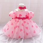 Vestido infantil con un mágico corazón rosa