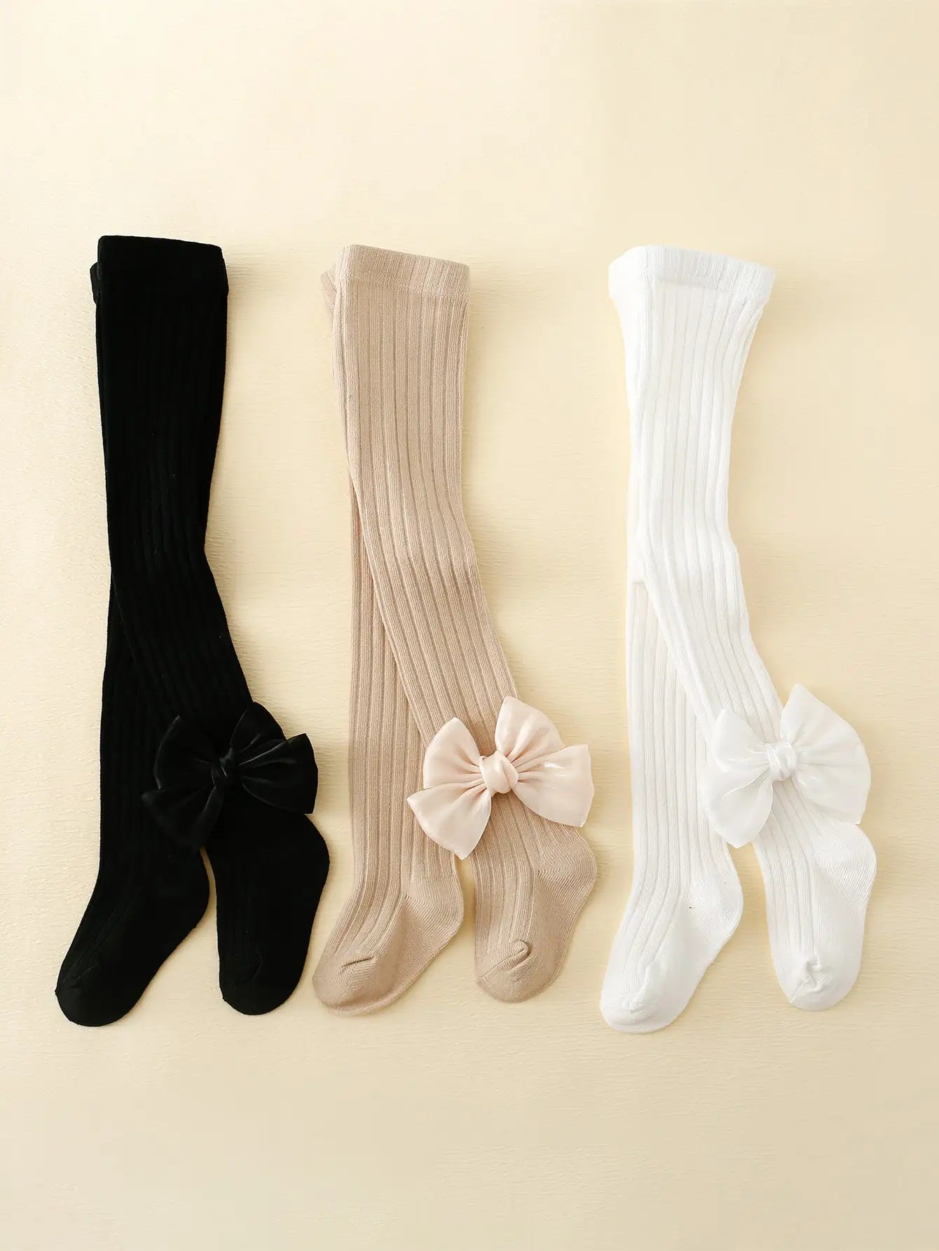 3 paia di collant con papillon