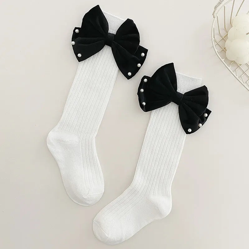 Chaussette longue blanche nœud papillon noir