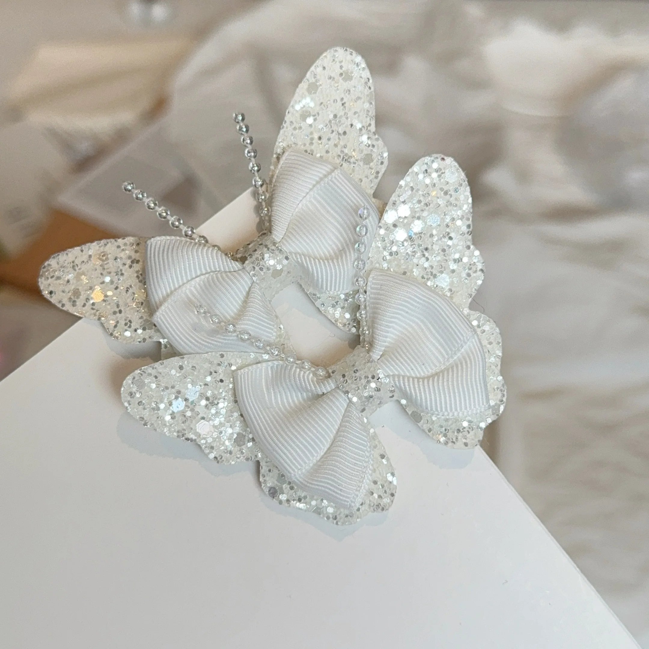 Set di 2 accessori a forma di farfalla