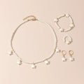 Boucles d'oreilles et bague assorties de la parure enfant étoile