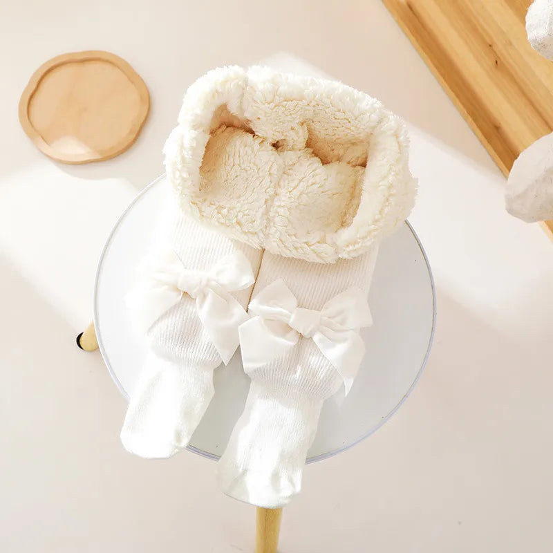 Collant polaire blanc avec nœud papillon 