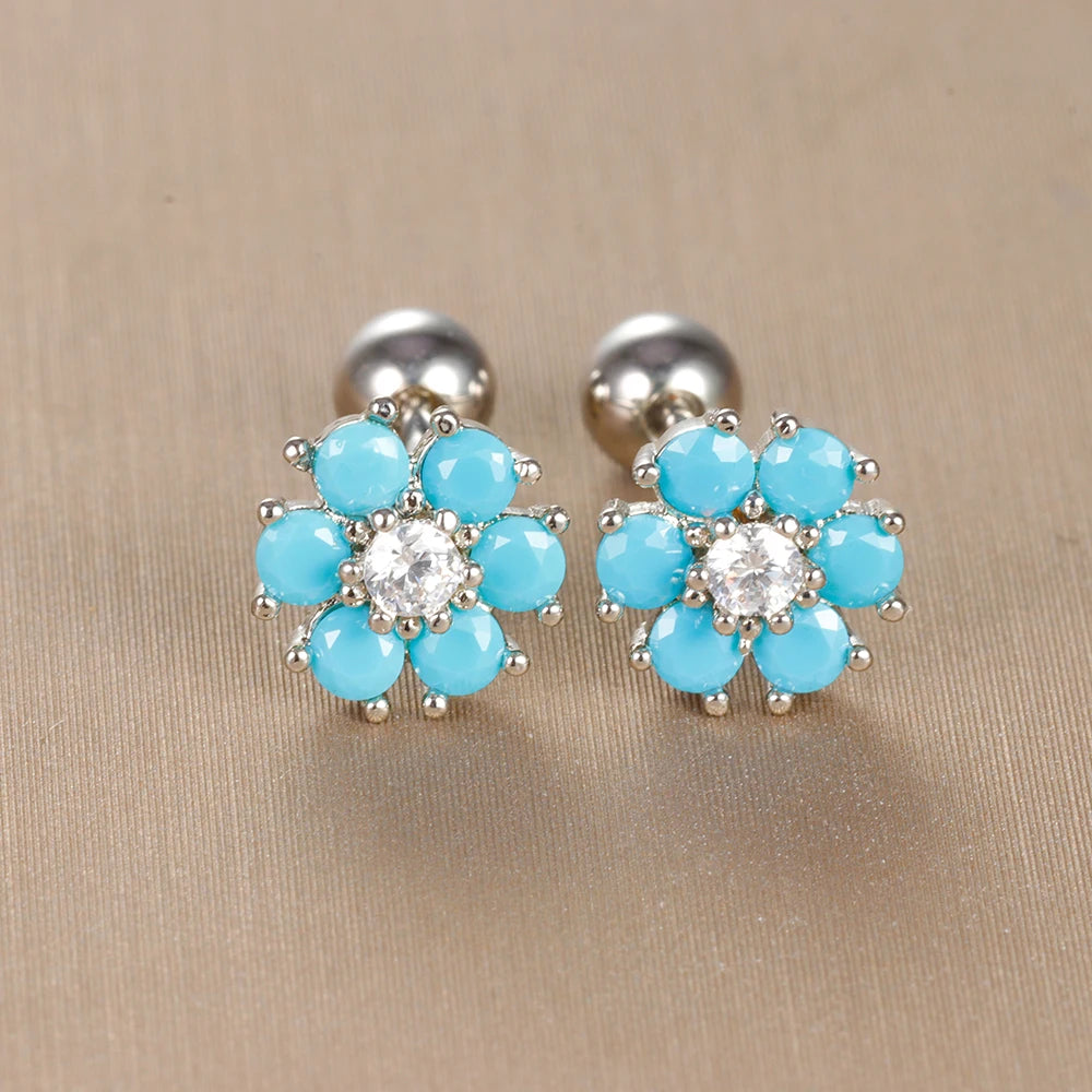 Bijoux pour petite fille : boucles d'oreilles fleurs avec cristaux bleu turquoise et monture argentée
