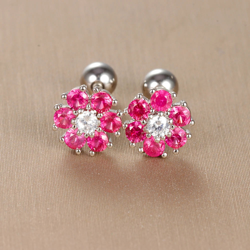 Paire de boucles d'oreilles Laly en forme de fleurs serties de cristaux rose rubis avec cœur en cristal blanc