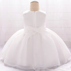 Vue de dos de la robe Jardin Enchanté avec son nœud en tulle