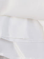 Vue des finitions soignées et de la doublure confortable de la robe Céleste, idéale pour la peau sensible des bébés