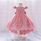 Robe de cérémonie rose pour bébé avec grand nœud papillon et jupe en tulle