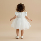 Vue de dos de la robe Coralie montrant le joli volume du jupon et le noeud en satin à la taille