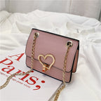 Bolso de niña pequeña con hebilla de corazón de colores