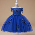 Robe de fête bleue pour enfant avec jupon évasé en tulle et broderies florales sur le bas